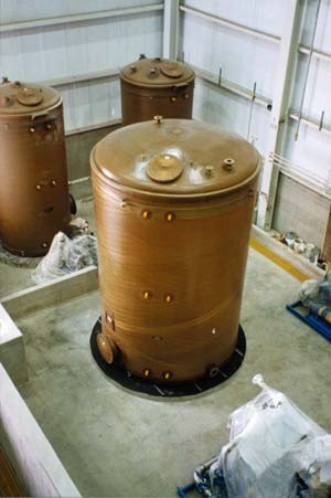 Filament wound fiberglass chemical storage tanks in the shop